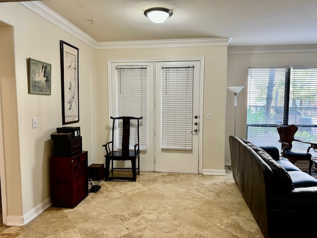 foyer featuring crown molding and a textured ceiling