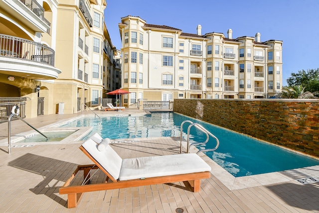 view of pool featuring a patio area