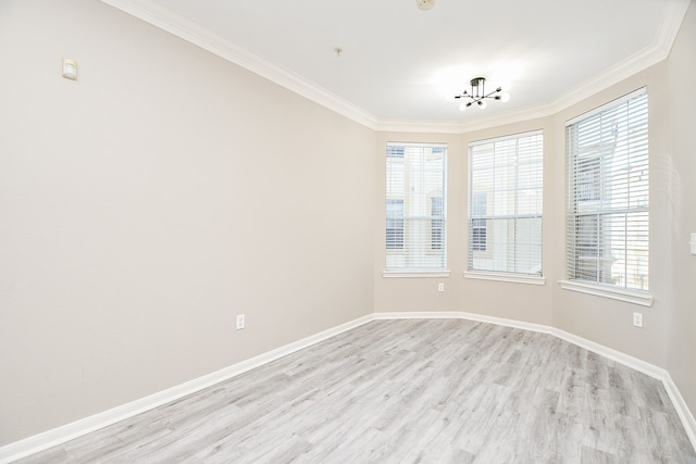 unfurnished room featuring ornamental molding, a healthy amount of sunlight, and light hardwood / wood-style floors