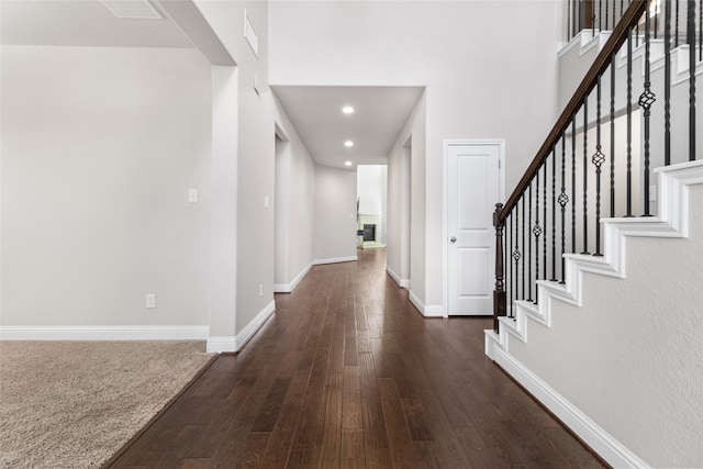 foyer entrance with dark wood-type flooring