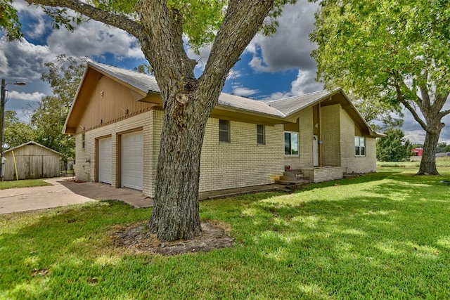 exterior space featuring a garage and a front lawn