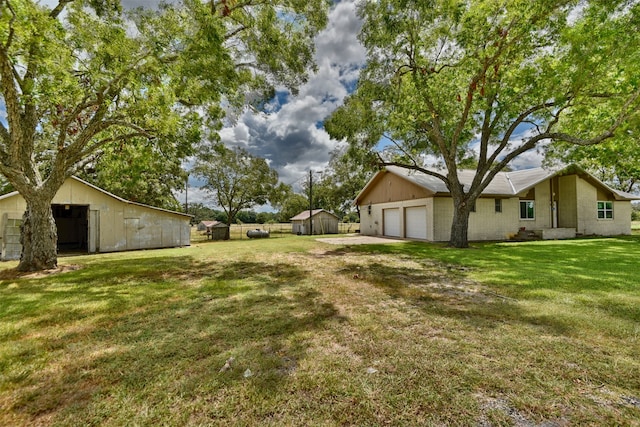 view of yard with a garage