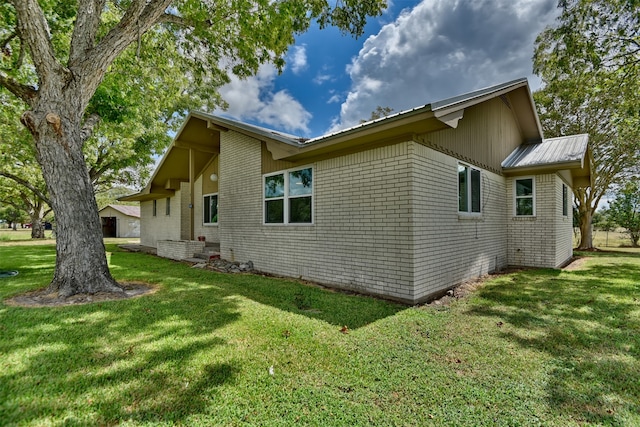 view of home's exterior featuring a lawn