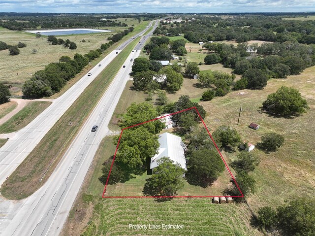 bird's eye view featuring a water view and a rural view