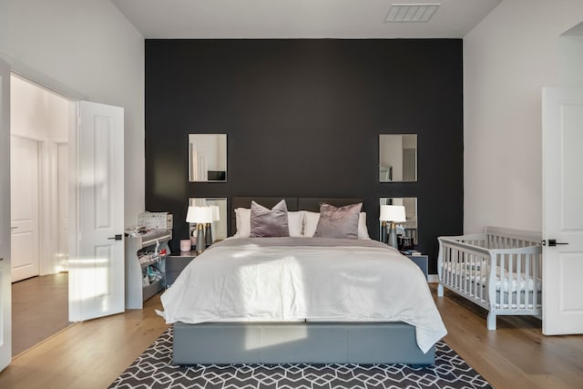 bedroom featuring hardwood / wood-style flooring