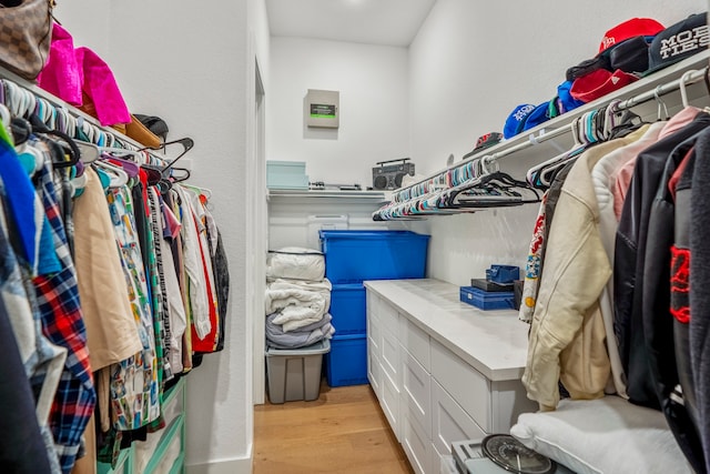 spacious closet with light hardwood / wood-style floors