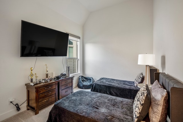 carpeted bedroom with vaulted ceiling