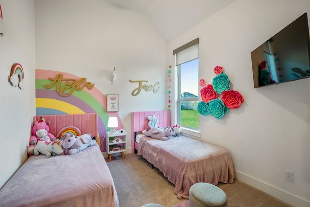 bedroom with lofted ceiling and carpet