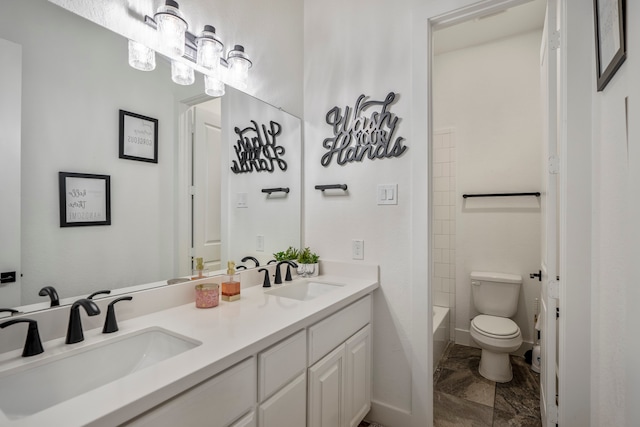 full bathroom featuring toilet, vanity, and  shower combination