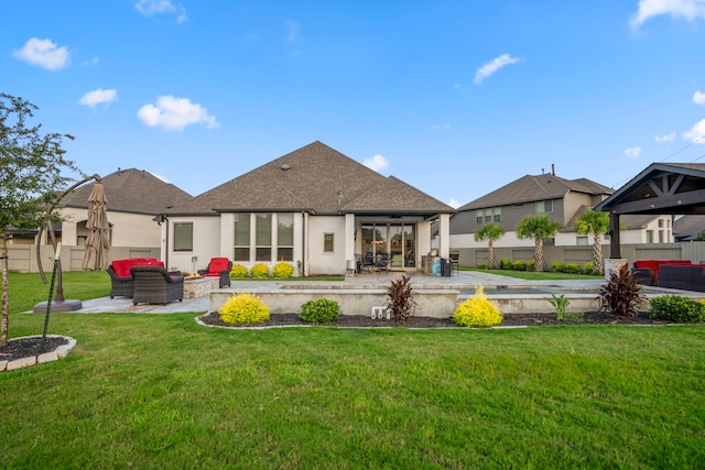 back of house featuring a yard and a patio