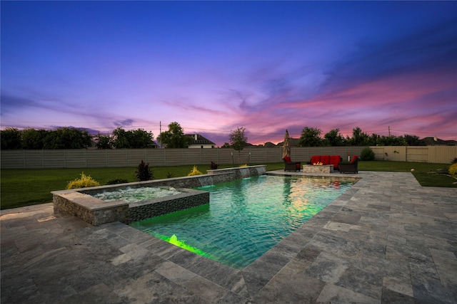 pool at dusk featuring an in ground hot tub, a patio, and pool water feature