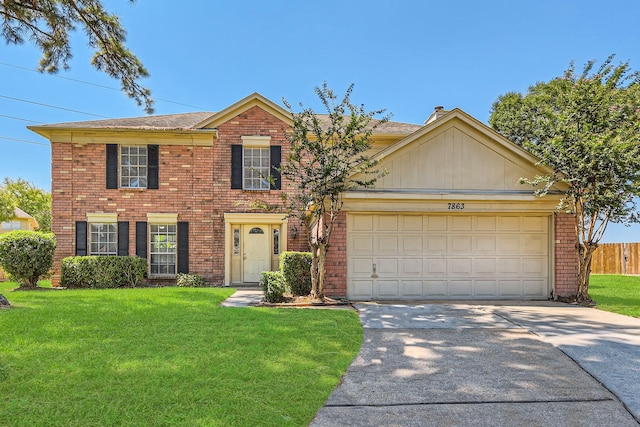 view of front of house featuring a front yard and a garage