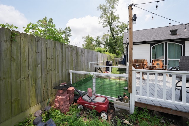 view of yard with a wooden deck