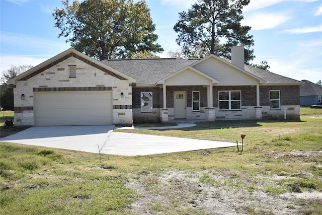 view of front of house with a garage and a front lawn