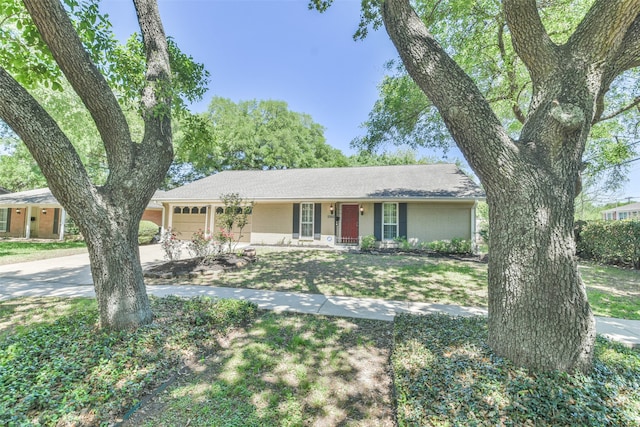 ranch-style house with covered porch and a garage