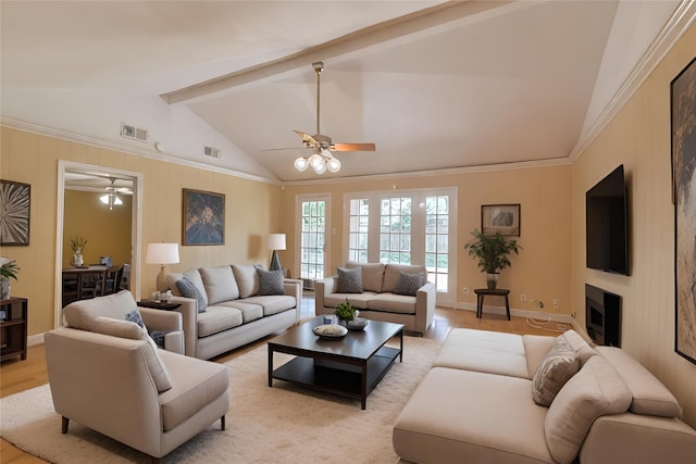 living room with lofted ceiling with beams, light wood-type flooring, and ceiling fan