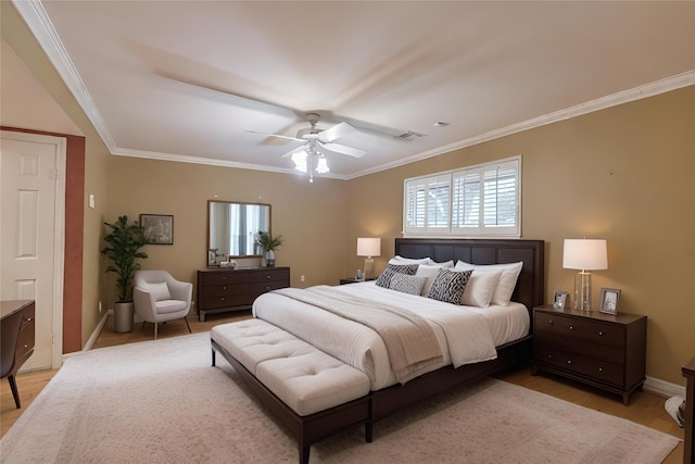 bedroom featuring crown molding, light wood-type flooring, and ceiling fan