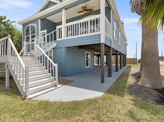 back of property with a patio and ceiling fan