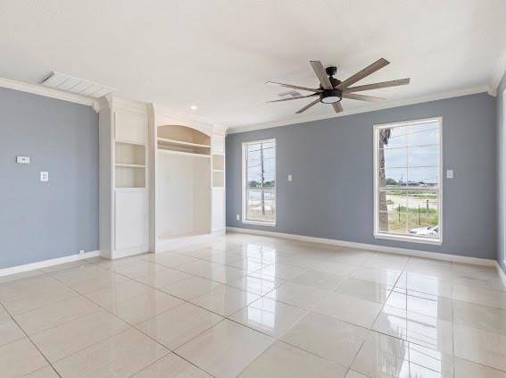 tiled empty room with crown molding and ceiling fan