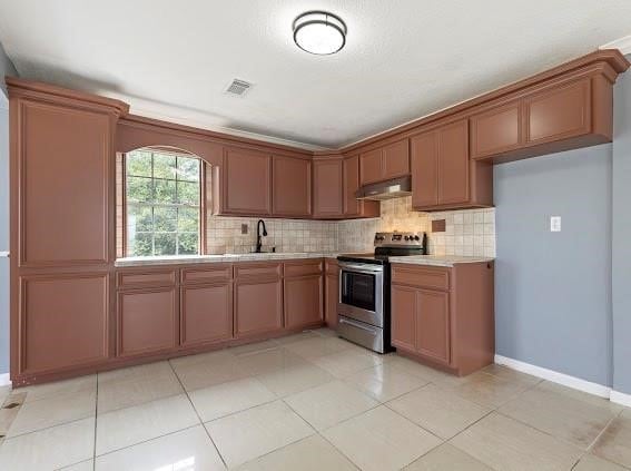 kitchen featuring ventilation hood, stainless steel electric range, light tile patterned floors, and tasteful backsplash