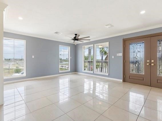 interior space with french doors, a healthy amount of sunlight, and light tile patterned flooring