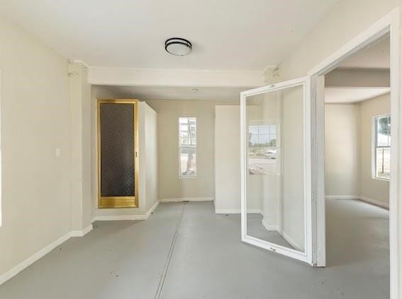 interior space featuring concrete floors and plenty of natural light