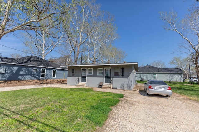 ranch-style house featuring a front yard