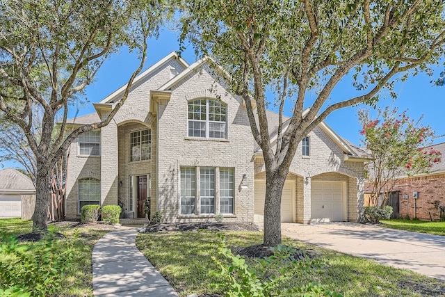 view of front facade featuring a front yard and a garage