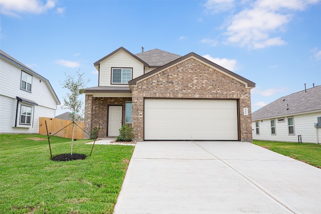 view of front facade with a garage and a front yard