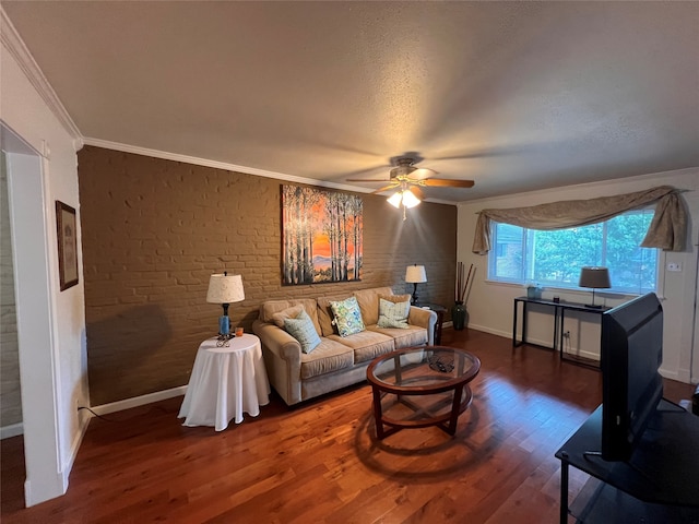 living room with ceiling fan, dark hardwood / wood-style floors, and ornamental molding