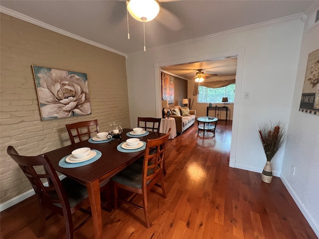 dining space featuring ornamental molding, hardwood / wood-style floors, and ceiling fan