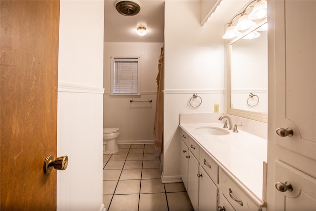 bathroom with tile patterned floors, toilet, and vanity