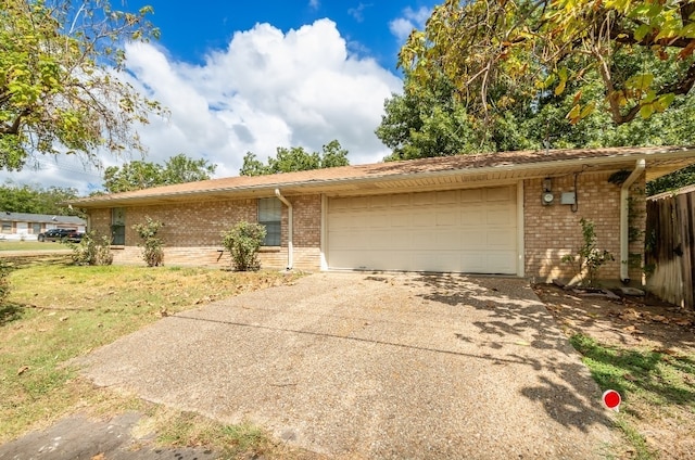 single story home featuring a front yard and a garage