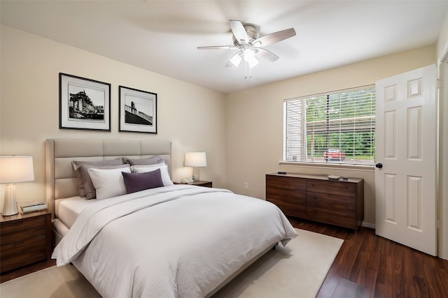 bedroom featuring ceiling fan and dark wood-type flooring