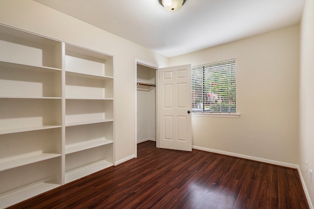 unfurnished bedroom with dark hardwood / wood-style floors