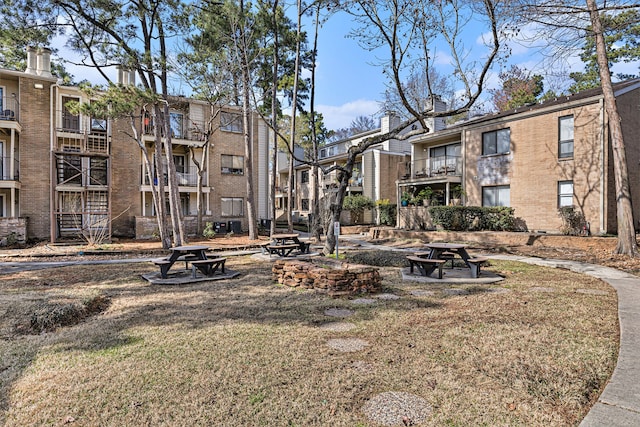 view of home's community with a lawn