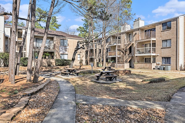 surrounding community featuring a fire pit