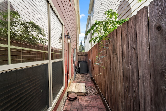 view of side of property featuring central AC