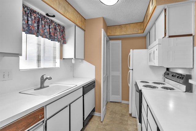 kitchen featuring white appliances, white cabinetry, a textured ceiling, and sink