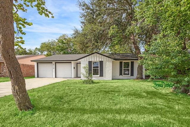 single story home with a garage and a front yard