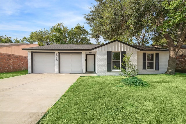 ranch-style home with a front lawn and a garage