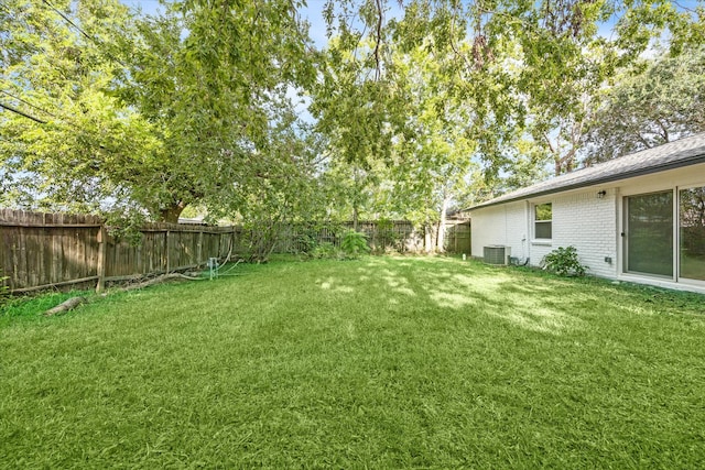 view of yard with central AC unit