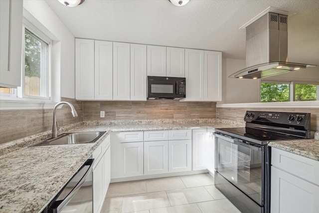 kitchen featuring white cabinetry, black appliances, sink, light stone countertops, and island exhaust hood