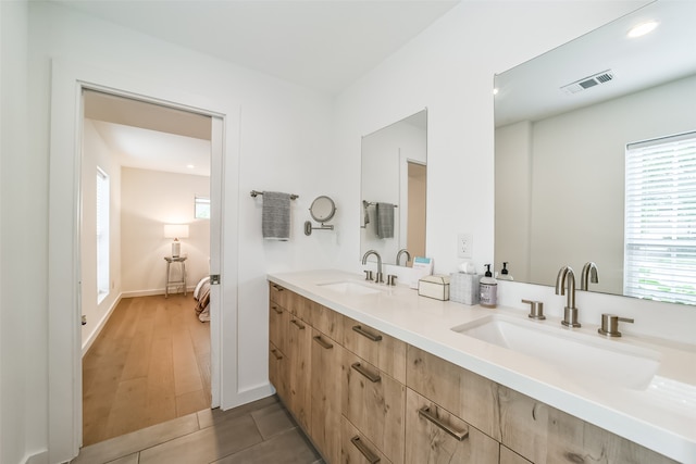 bathroom with vanity and wood-type flooring