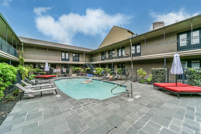 view of pool featuring a patio area