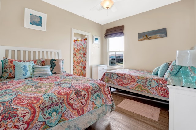 bedroom featuring ceiling fan and wood-type flooring