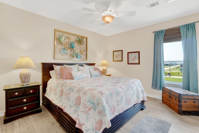 bedroom featuring light wood-type flooring and ceiling fan