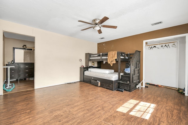 bedroom with wood-type flooring and ceiling fan