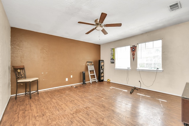 empty room with wood-type flooring and ceiling fan