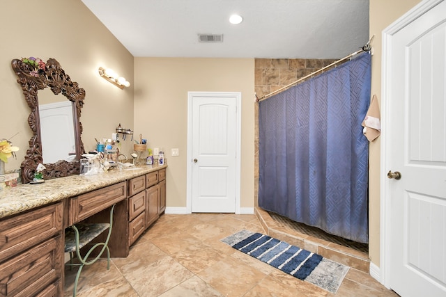 bathroom with vanity and curtained shower